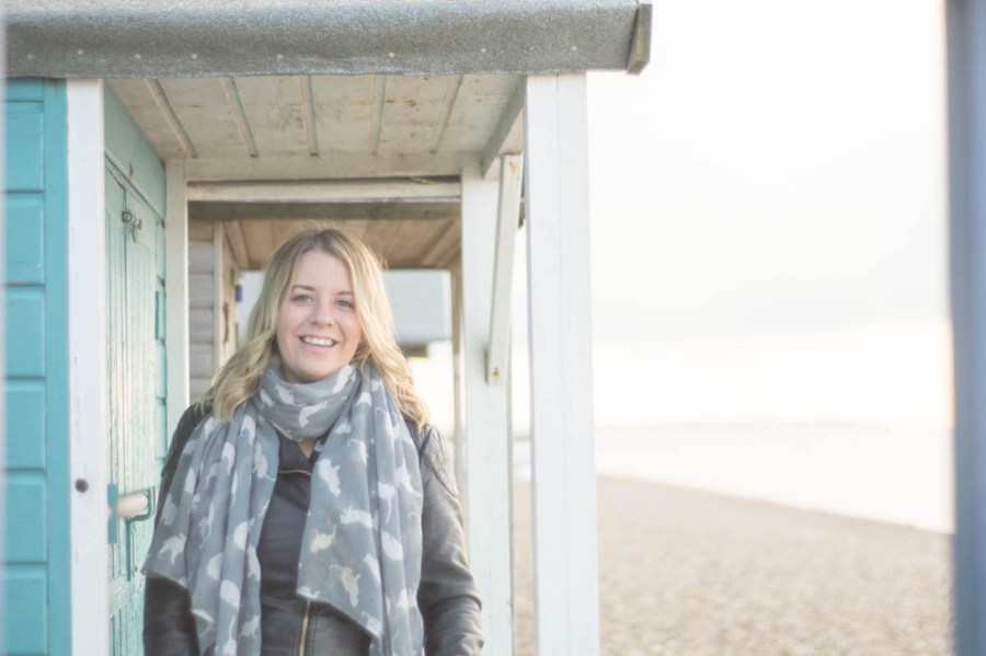 Paula framed by beach huts web.jpg